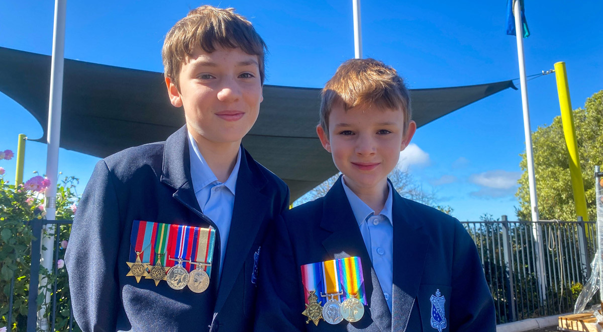 Dean and Aiden Irwin from St Canice's Catholic Primary Katoomba wearing medals for ANZAC Day