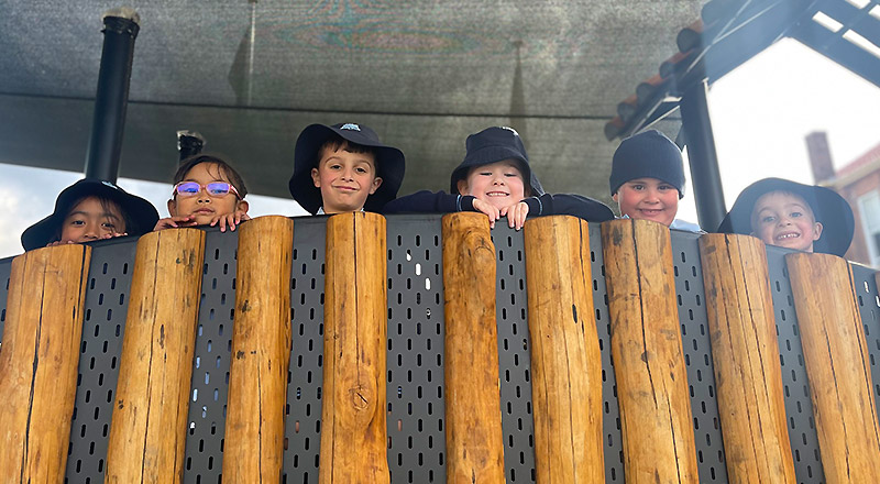 St Canice's Catholic Primary Katoomba students on playground equipment