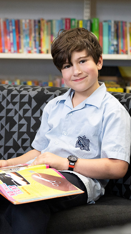 Student reading in St Canice’s Katoomba School Library