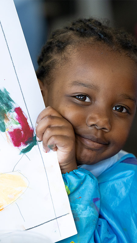 St Canice's Katoomba student holding artwork
