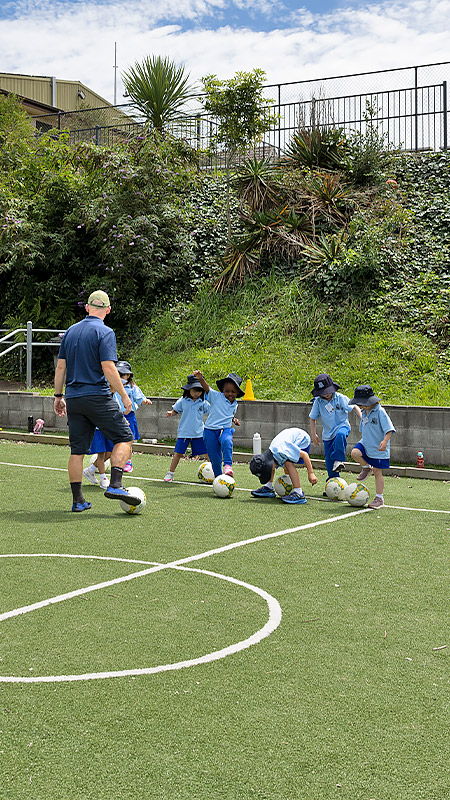 St Canice’s Primary Katoomba students playing on soccer oval