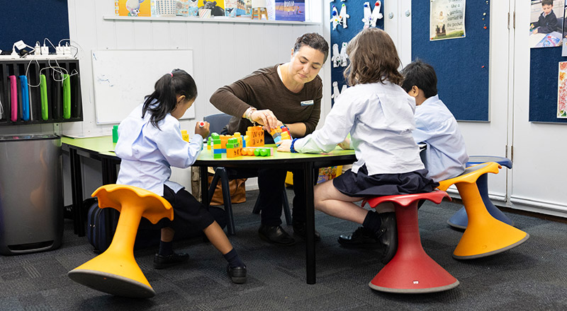 Dedicated teachers assisting students in class at St Canice’s Katoomba