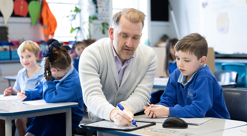 Dedicated teachers assisting students in class at St Canice’s Katoomba