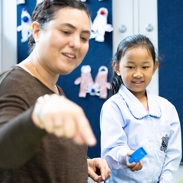 Dedicated teachers assisting students in class at St Canice’s Katoomba