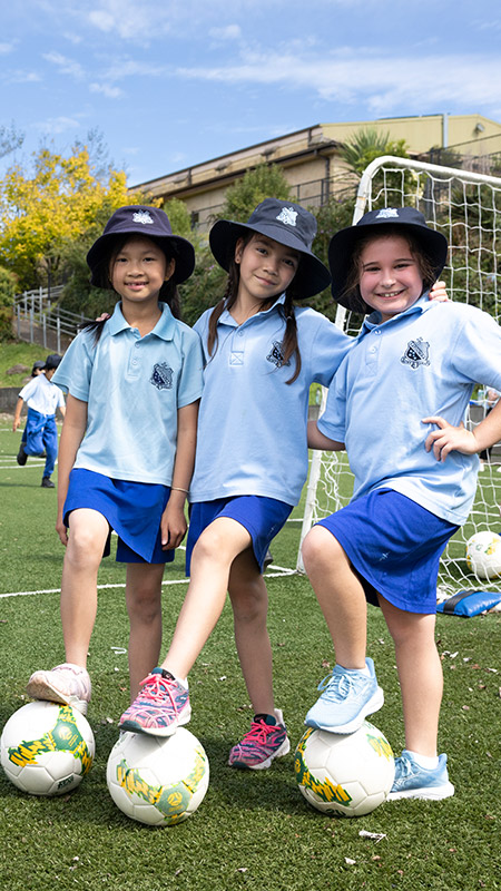 Students outdoors at St Canice's Katoomba playing soccer