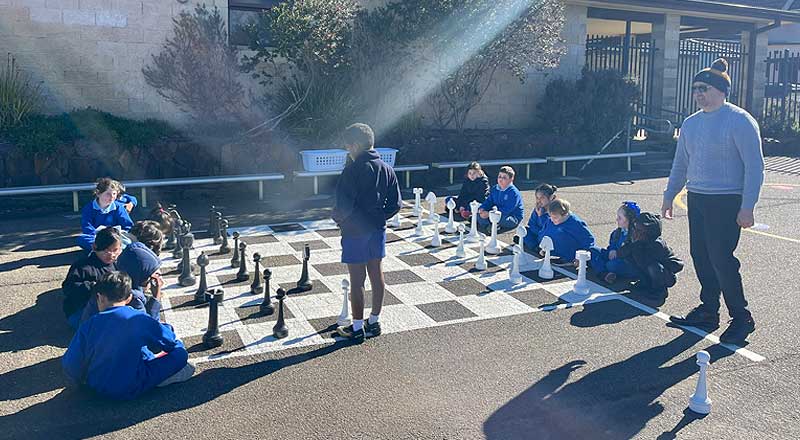 St Canice’s Katoomba students playing chess on outdoor chess grid