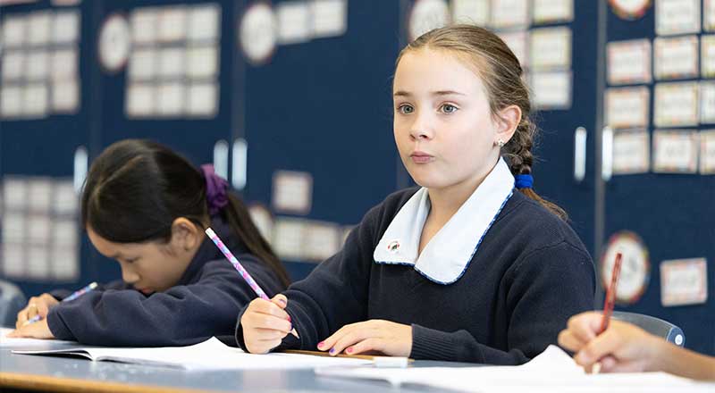 St Canice’s Katoomba students writing speeches into workbook